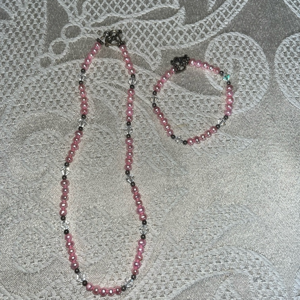 Girl’s beautiful handmade pink necklace and bracelet set.